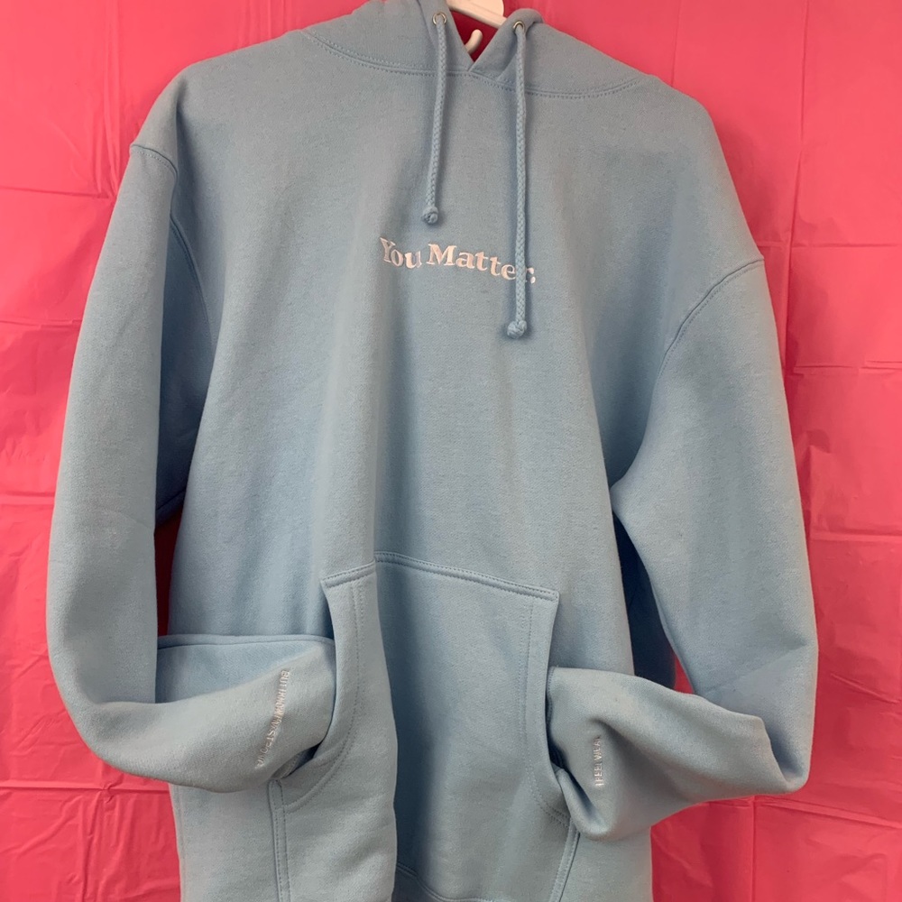 You Matter baby blue hoodie by Demetrius Harmon